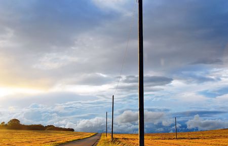 Swabian Alb Landscape with lonely power poles on a September eveningの写真素材