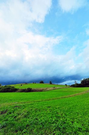 A field on Swabian Alb with a coming heavy thundersturmの写真素材