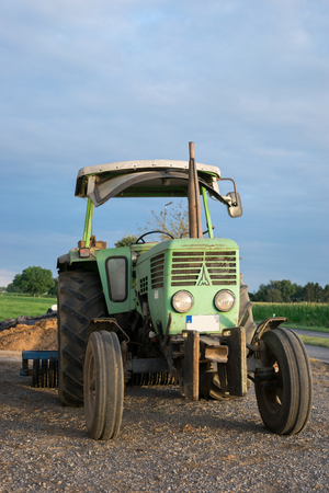 Old Tractor Barn Sunlight Blue Sky Agriculture Harvest Relax.の写真素材