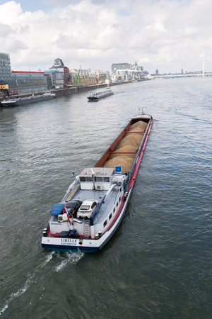 Cargo Ship Bulk Load River Rhine Cologne Germany Transportation Industrial Goods Water.の写真素材