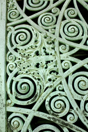 Close up of a panel on metal doors aged and weathered to a green patina, on a mausoleum at Graceland Cemetery, Chicago, Illinois, USAの写真素材