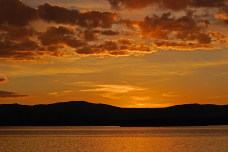 A colorful sunset over the mountians west of Walden Reservoir in Northern Colorado on a pleasant fall evening.の写真素材