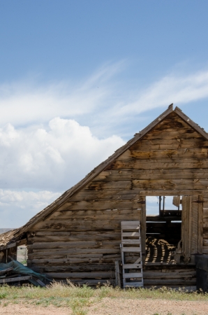 A storm builds behind an old barn in good condition in Utah のeditorial素材
