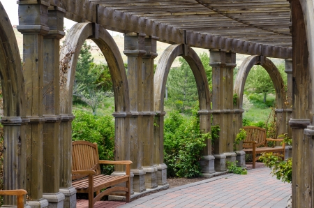 Benches and arches on beautiful walkway through gardens of Thanksgiving Point in Sandy, Utah.のeditorial素材
