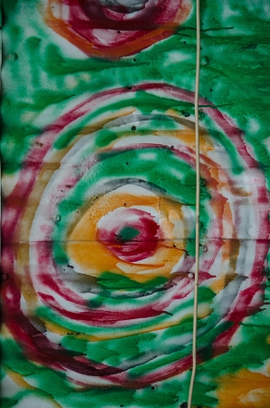 A colorful pattern of concentric images painted on the outside wall of an old warehouse in downtown Colorado Springs, Colorado のeditorial素材