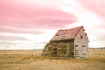 The last remaining wooden building of ghost town, Eastonville, Colorado with sunset colors east of Colorado Springs の写真素材