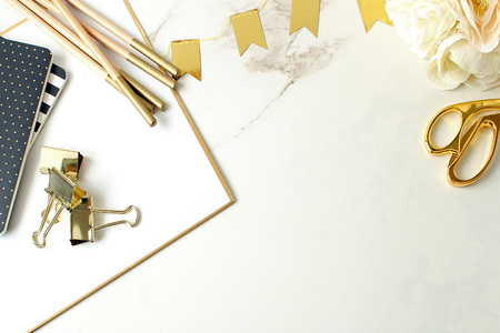 Elegant white, gold and black office supplies on white marble copy space.の写真素材