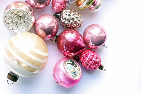 Vintage pink and pastel colored vintage ornaments above view.の写真素材