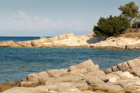 Blue water and seaside rocks in Zakynthos, Greeceの写真素材