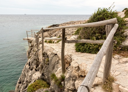Wooden dock at the cliffの写真素材