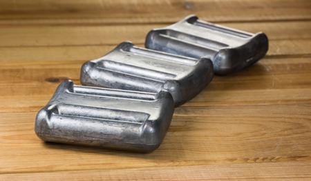 Row of lead weights for a diving weight beltの写真素材