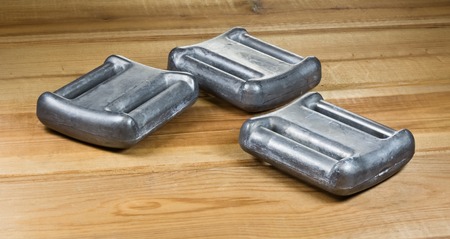Three weights made of lead for a diving weight belt