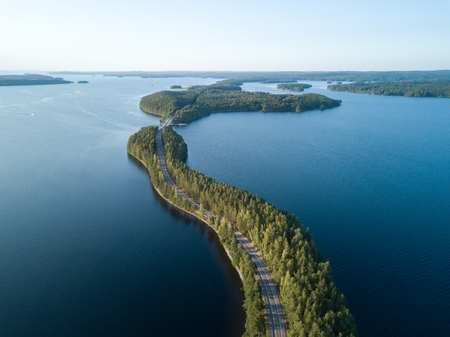 Aerial view of ridge road crossing a lakeの写真素材