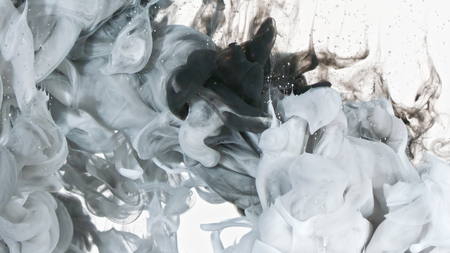 White and Black inks are mixed in water. Use for backgrounds or overlays requiring a flowing and organic look. Amazing video asset for motion graphics projects or VFX composites.の写真素材