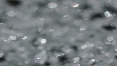 The Anamorph Bokeh stock video features a circle rotation in a clockwise direction of grey blurred lights. You can use it as an overlay for creative video effects, artistic videos, and as a texture by changing the blending mode to add or screen.の写真素材