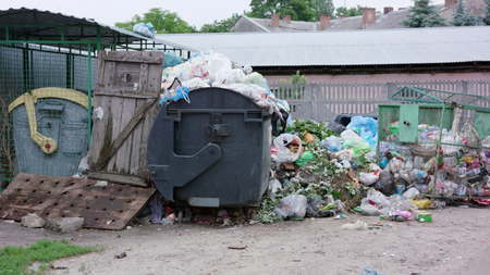 Piles of garbage bags in the city. Long shot