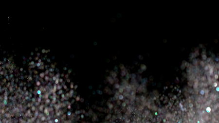With the use of Realistic Glitter Exploding on Black Background. These clips are perfect for visual effects, compositing, and motion graphics. Use blending mode (screen).の写真素材