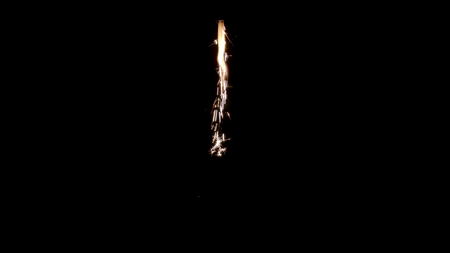 Magic glowing Flow of Sparks from Firework in the Dark. You can use Sparks as an overlay for creative video effects, artistic videos, and as a texture by changing the blending mode to add or screen.の写真素材