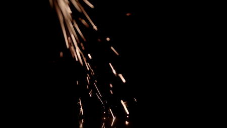 The Metal Sparks has metal sparks flying in the air over a black background. Drop it in and change its blending mode to remove the black background.の写真素材