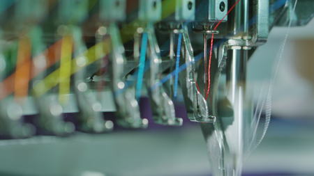 Embroidery machine starting to embroider with a needle on the fabricの写真素材