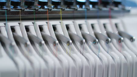 Embroidery with embroidery machine detail skein threadの写真素材