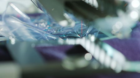 Embroidery machine starting to embroider with a needle on the fabric