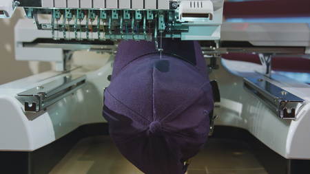 Embroidery machine deals logo on the cap dolly shootの写真素材