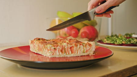 Close up of womans hands cutting pie dolly shootの写真素材
