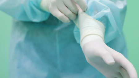 Hands of ophtalmology surgeons and assistants with ophtalomological surgery tools during surgical treatment. Indoor. Close up. Doctor wears gloves.の写真素材