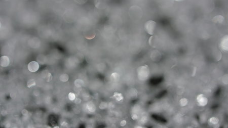 The Circles Bokeh stock video features a circle rotation in a clockwise direction of grey blurred lights. You can use it as an overlay for creative video effects, artistic videos, and as a texture by changing the blending mode to add or screen.の写真素材