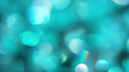 The Circles Bokeh stock video features a circle rotation in a clockwise direction of turquoise blurred lights. You can use it as an overlay for creative video effects, artistic videos, and as a texture by changing the blending mode to add or screen.の写真素材