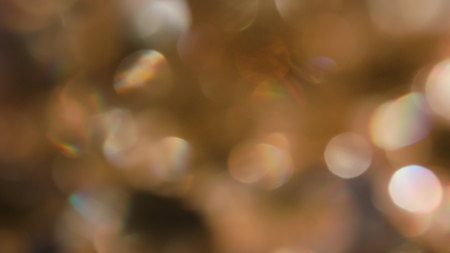 The Circles Bokeh stock video features a circle rotation in a clockwise direction of yellow blurred lights. You can use it as an overlay for creative video effects, artistic videos, and as a texture by changing the blending mode to add or screen.の写真素材