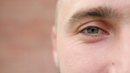 A close-up of a young mans eye. Macro close-up shot