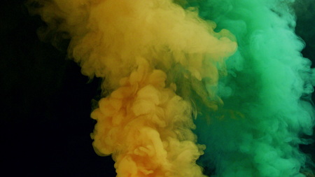 violet and blue bomb smoke on black background