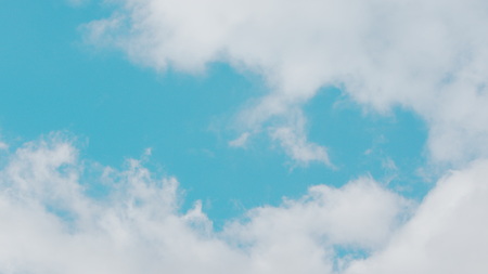 Blue sky background with white clouds. Long shotの写真素材