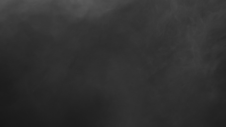 White clouds of vapor smoke are isolated on a black background. Gas explodes, swirl and dances in space. A magic fog dust texture effect that can be used by overlay and changing their transparency.の写真素材