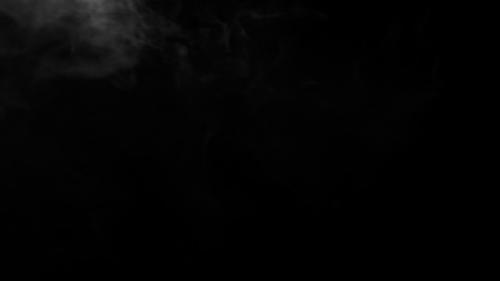 White clouds of vapor smoke are isolated on a black background. Gas explodes, swirl and dances in space. A magic fog dust texture effect that can be used by overlay and changing their transparency.の写真素材