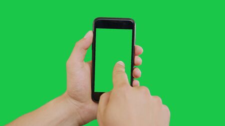 Finger Swipes Center Left Smartphone Green Screen. Pointing Finger Clicking On Phone Screen with Green Background. Use in any project that depicts finger, gesture, touchscreen and the like.の写真素材