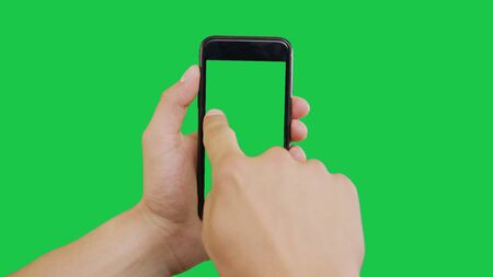 Finger Swipes Right Smartphone Green Screen. Pointing Finger Clicking On Phone Screen with Green Background. Use in any project that depicts finger, gesture, touchscreen and the like.の写真素材