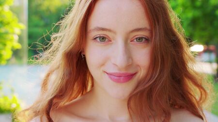 Red-haired lady. Emotion. Smile Closeup shot