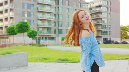 Red-haired lady. Emotion. Smile Medium shotの写真素材