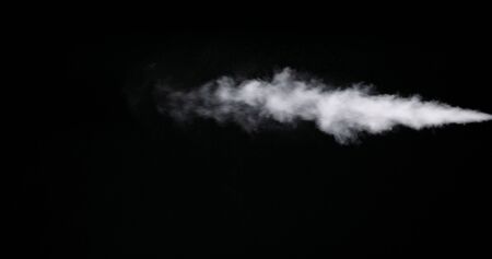 Real white smoke isolated on black background with visible dropletsの写真素材
