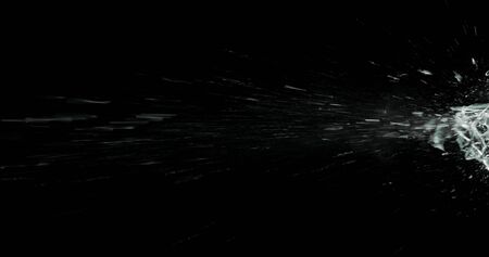 Real frost on a window. Frostwork pattern ice crystals on black background. Dark surface with abstract ice structure makes to overlay or add a frost effect.の写真素材