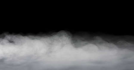 heavy fog passing across a black background.の写真素材