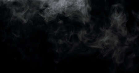 smoke rising up against the top of the frame.の写真素材