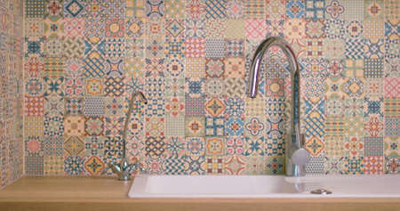 water flowing from the tap in the kitchenの写真素材