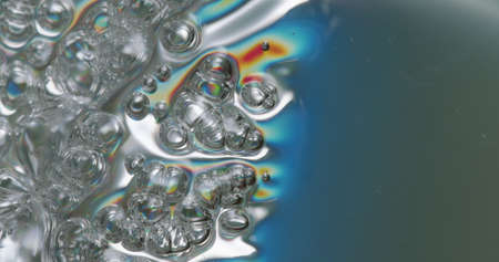 Iridescent Bubble Background. bubbles forming in an iridescent plastic surface.