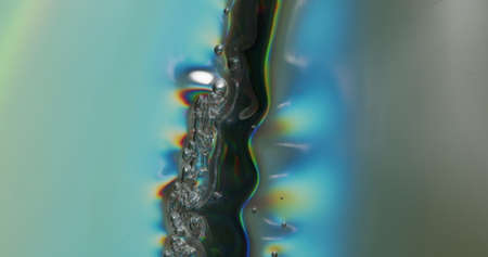 Forming Bubbles In Metallic Sheet. Metallic sheet being depressed onto a surface, forming bubbles...