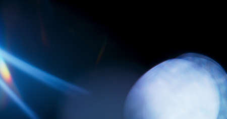 Blue Light Flare Prism Rainbow Light Flares Overlay on Black Backgroundの写真素材