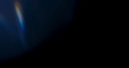 Prism Rainbow Light Flares Overlay on Black Backgroundの写真素材